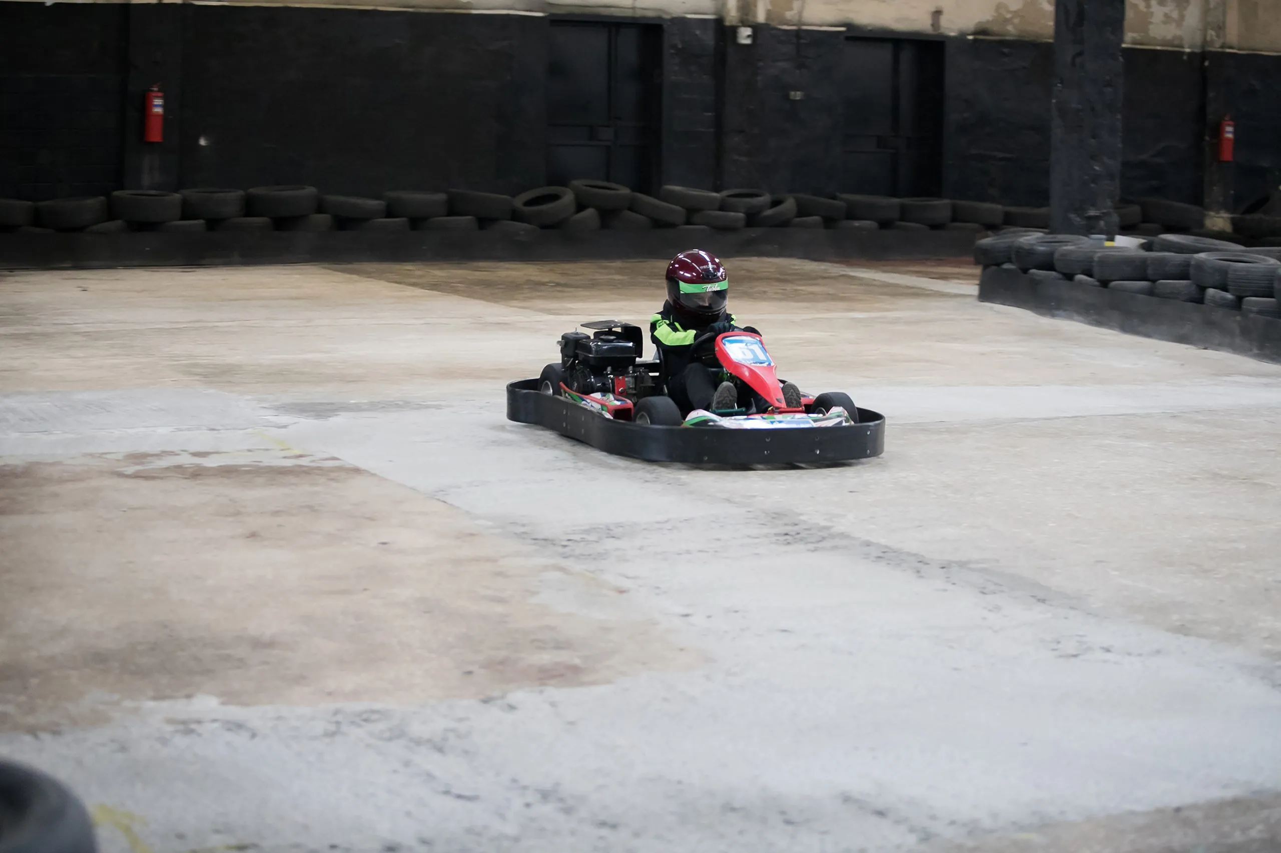 Karting Championship. Driver in karts wearing helmet, racing suit participate in kart race. Karting show. Children, adult racers karting.